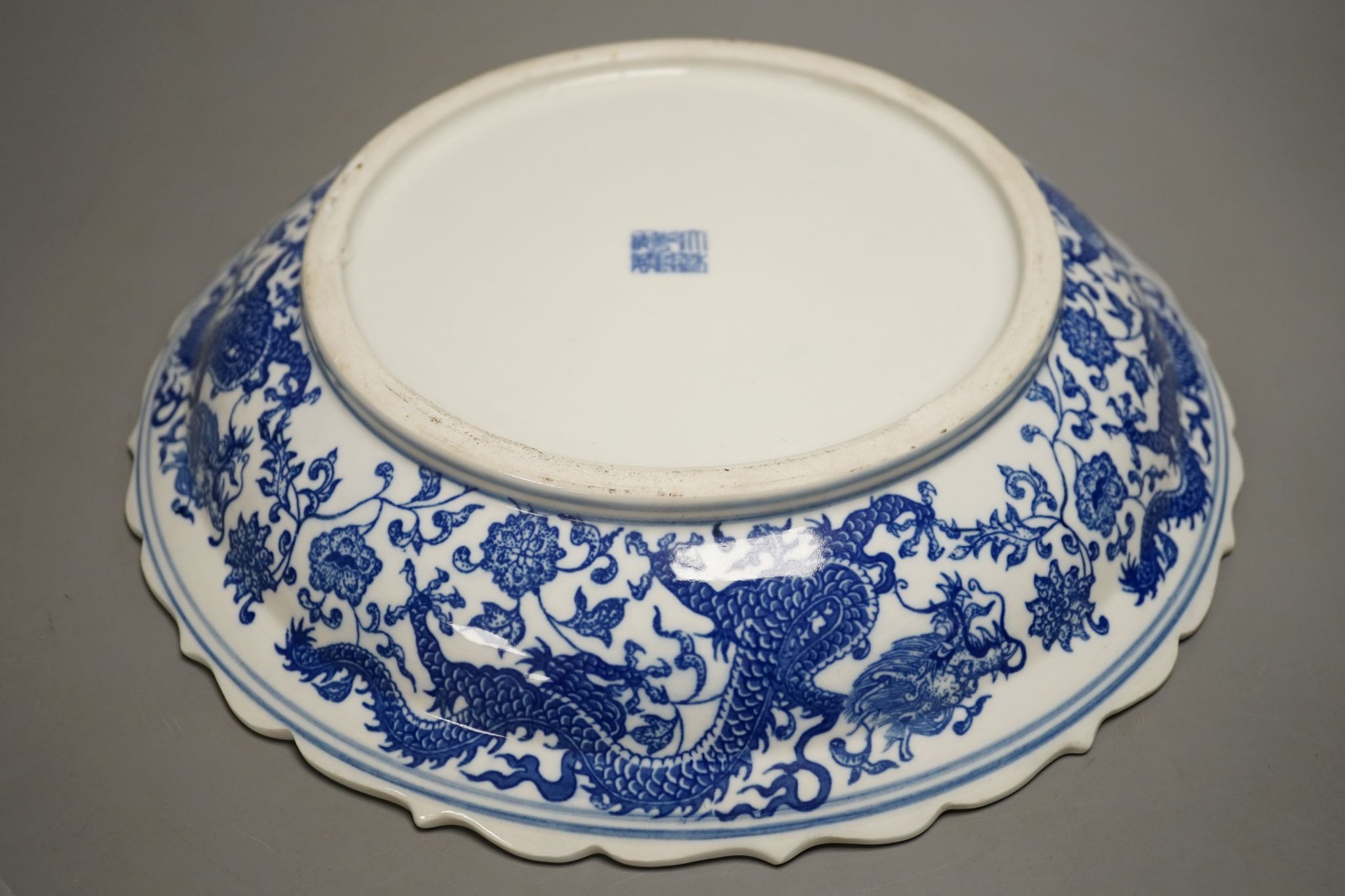 A Chinese blue and white ‘dragon’ dish 31cm